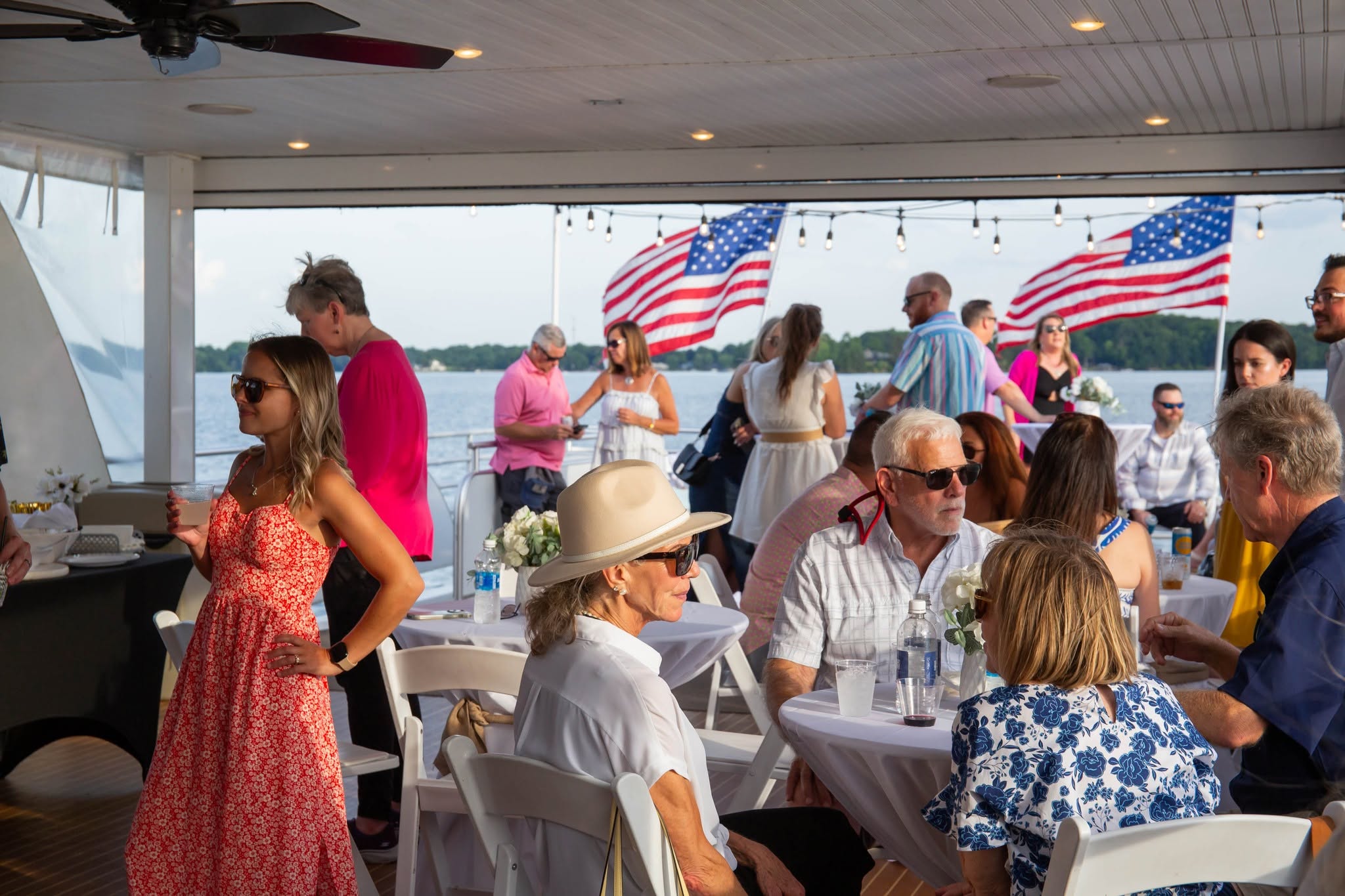 A holiday weekend gathering on the deck of a lakefront house in Denver NC